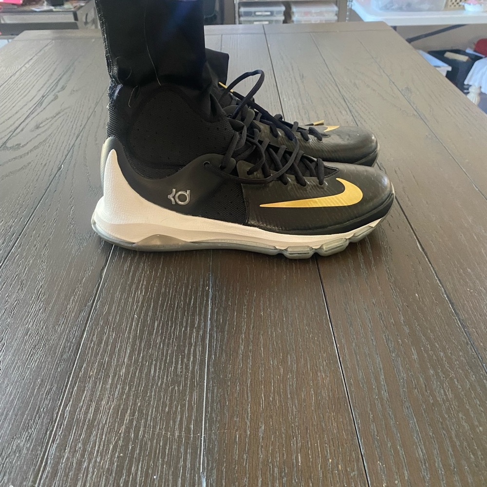KD’s by Nike sock shoes.  Black with gold logo.  Men’s size 11.